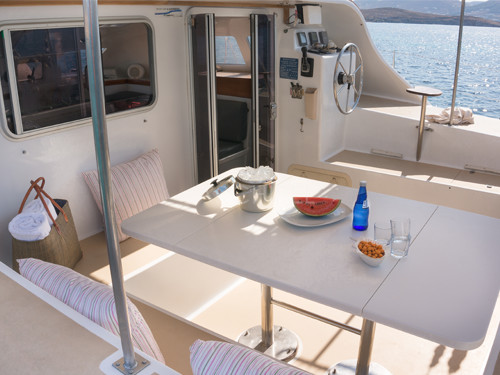 In the Greek islands where the mild climate invites you outdoors, the Punch catamaran's verandah offers a friendly space for meals and relaxation. In the Greek islands where the mild climate invites you outdoors, the Punch catamaran's verandah offers a friendly space for meals and relaxation.